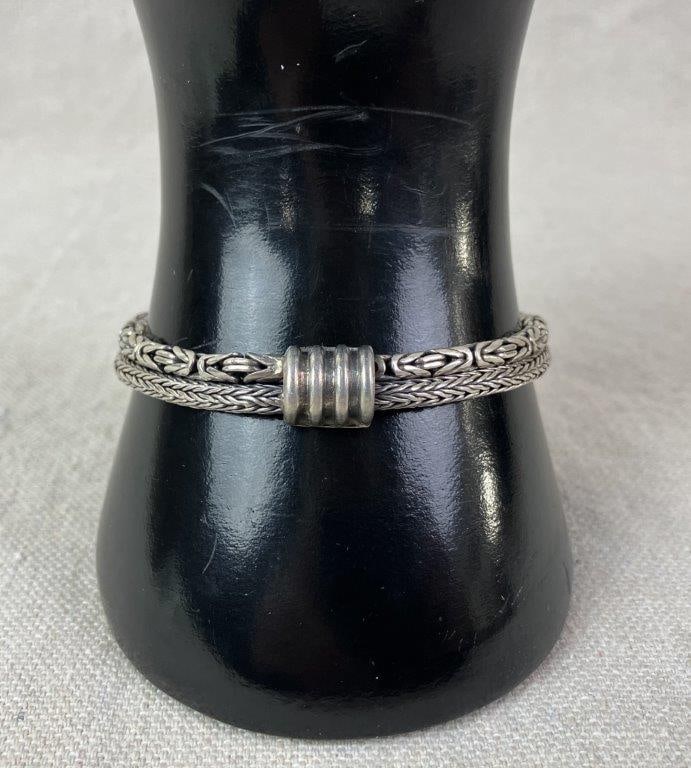 GeoArt Sterling Silver Braided Bracelet: GeoArt sterling silver bracelet featuring braided rope chain designs accented with robust decorative elements, secured with a box clasp. Marked “GeoArt” and 925 to clasp. GeoArt is a line