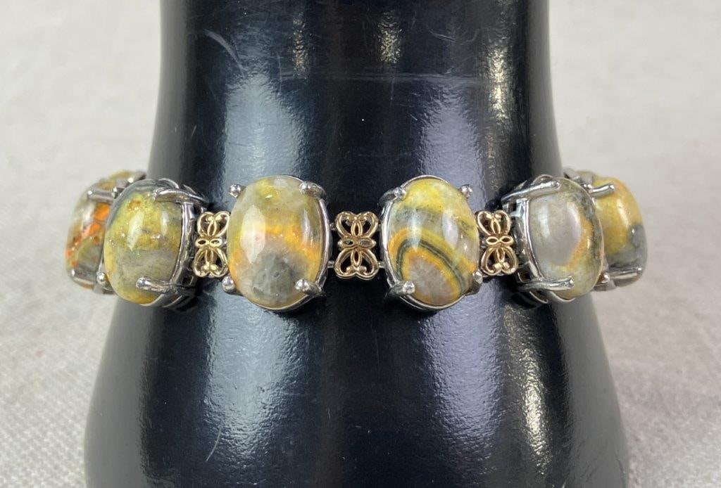 Sterling Silver and Bumblebee Jasper Bracelet: Chain-link bracelet set with vibrant bumblebee jasper cabochons, crafted in sterling silver with a rich gold vermeil finish accents. Bracelet measures approx. 7" L. Total weight including stones