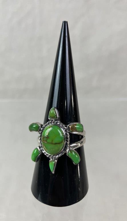 Sterling Silver Turtle Ring: Sterling silver ring featuring a central turtle form framed by a rope-style border, decorated with vibrant green enamel cabochons accented by goldtone veining. Marked “Philippines” and