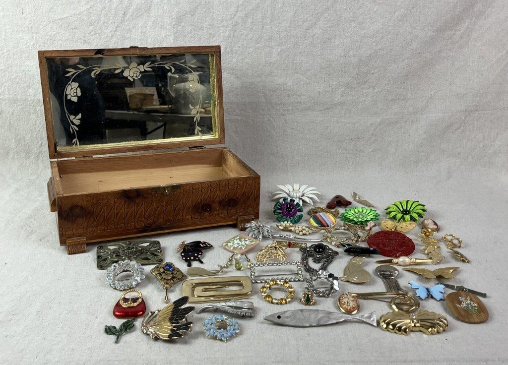 Vintage Cedar Jewelry Box with Brooches: Hand-carved cedar jewelry box featuring intricate floral and scrollwork carving to the lid and sides, raised on carved feet. Lid decorated with a decoupage pastoral scene depicting yellow flowers in