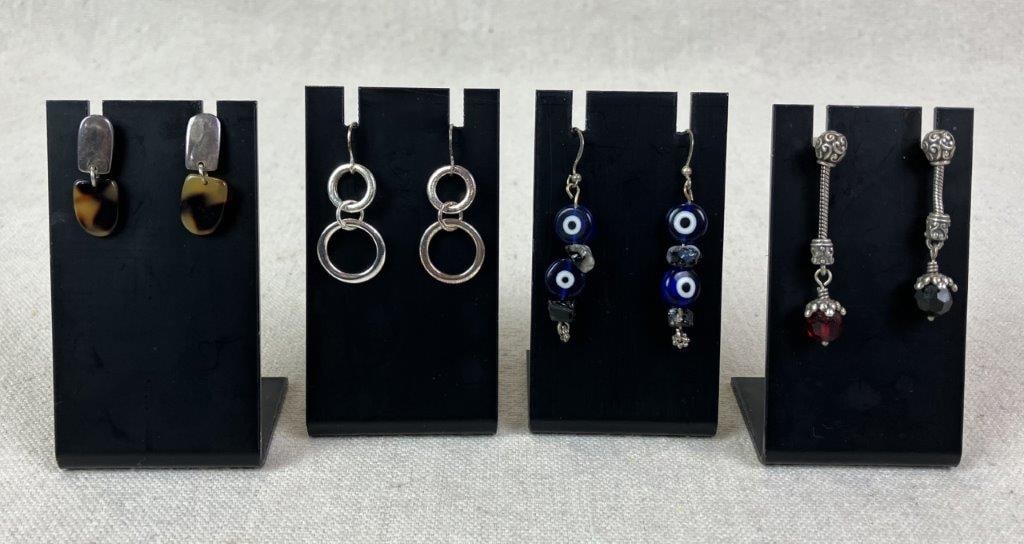 Four Pairs of Vintage Earrings: Grouping of four pairs of vintage earrings including one pair with art glass style beads in acrylic in a dangle form, one pair with tortoiseshell adornments and sterling silver components (unmarked bu