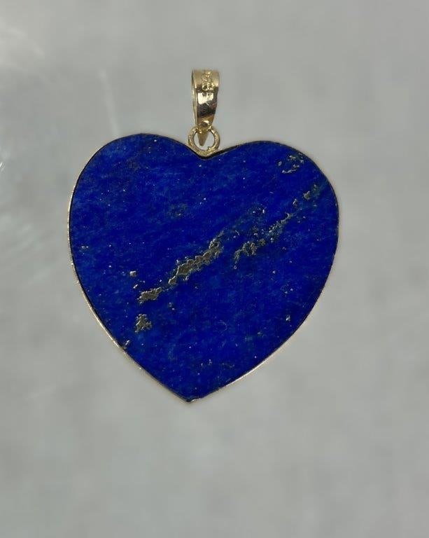 14 Kt Gold and Lapis Lazuli Heart Pendant: Heart-shaped pendant featuring a brilliant blue polished lapis lazuli inlay set within a delicate 14 kt gold frame. Tested for gold content but unmarked. Measures approx. 5/8" H x 5/8" W. In good