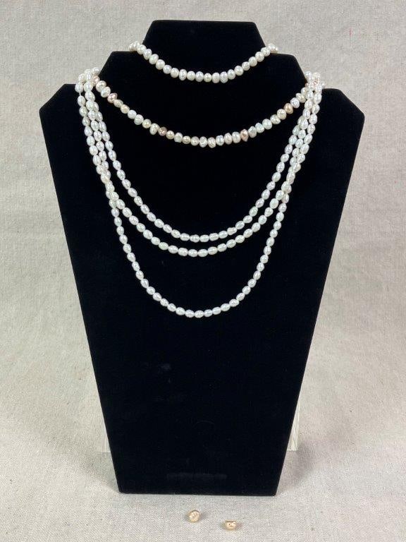 Five Strands of Freshwater Pearls: Group of five strands of white potato-form freshwater pearls, displaying natural luster and organic shape. Longest strand measures approx. 16 1/4" L. In good condition with light wear consistent with