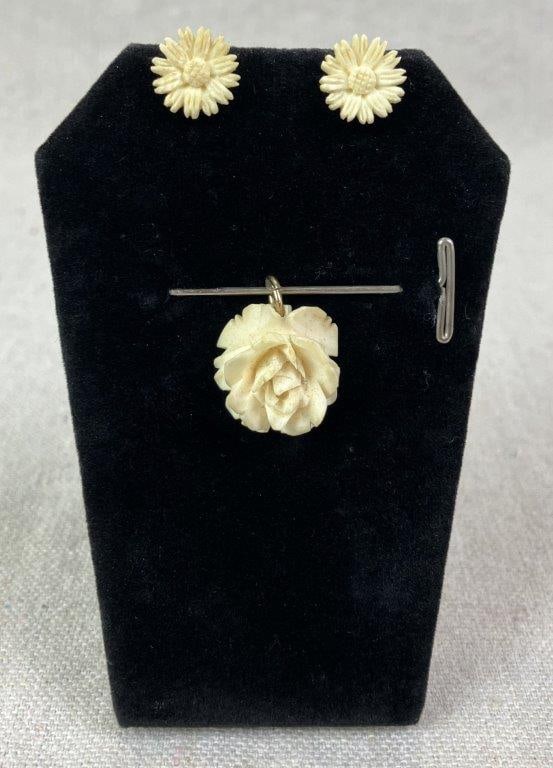 Bone Carved Flower Pendant and Earrings: Group of carved bone jewelry including two flower motif stud earrings with finely carved detailing and sterling silver hardware, together with a rose-form pendant exhibiting detailed carving. Various
