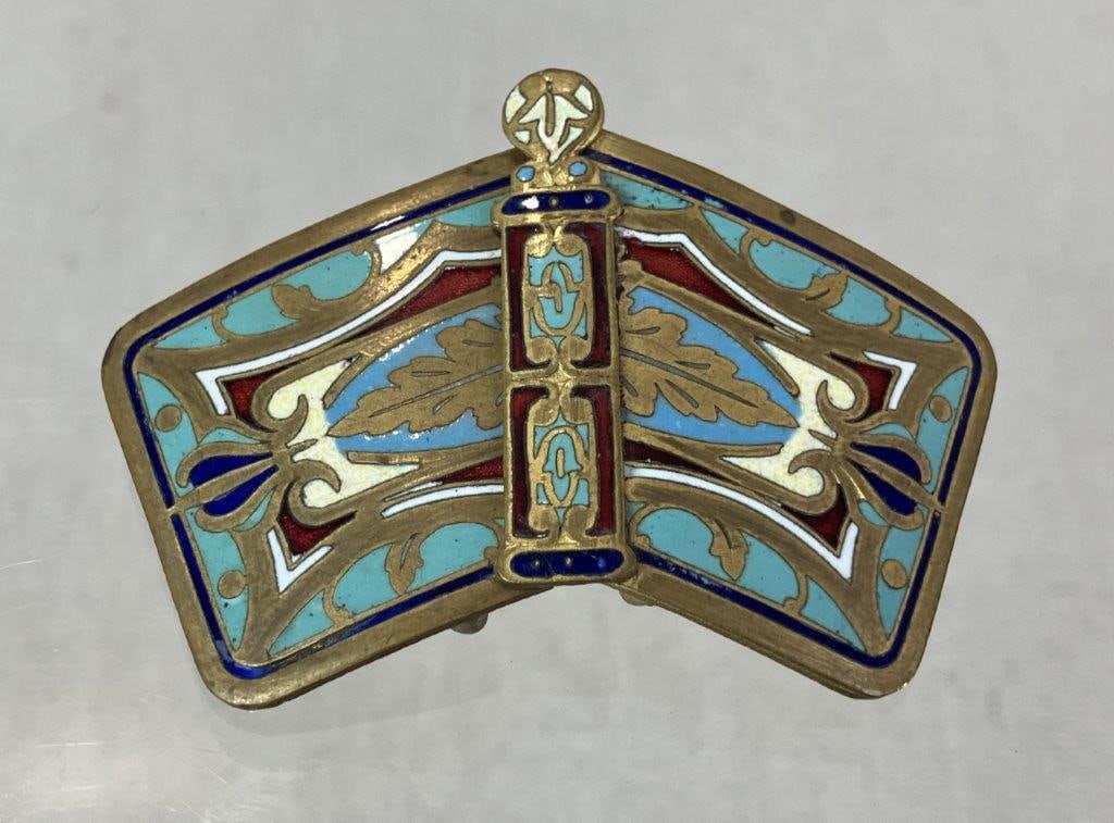 Late 19th Century Art Nouveau Women's Belt Buckle: Late 19th century women's belt buckle in the characteristic Art Nouveau taste, featuring an elegant flowing brass form accented with vibrant enamel in sinuous swirling designs. Entire piece measures