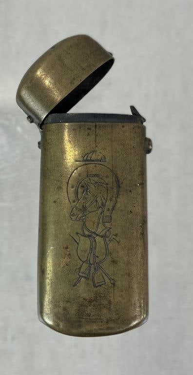 Antique Equestrian Horse Motif Match Safe: Late 19th to early 20th century brass match safe featuring a central English equestrian horse head motif complemented by engraved horseshoe and saddle details. Executed in a classic pocket-form