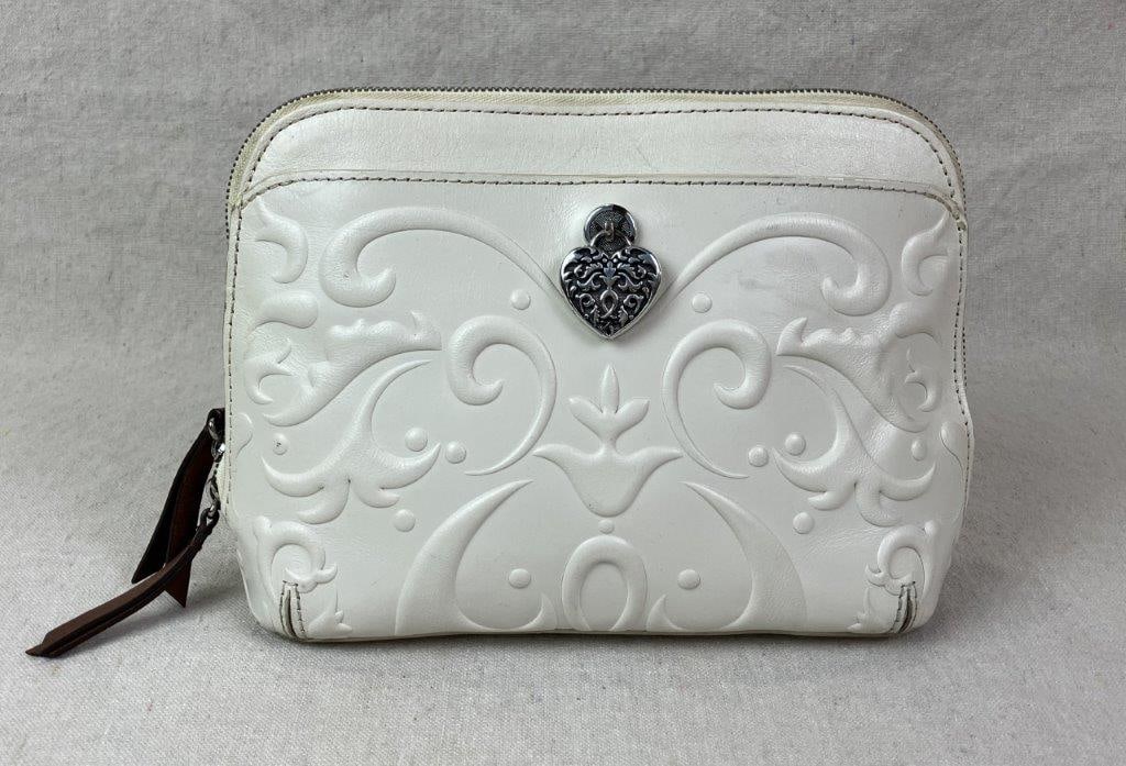 Brighton Alexa Cordoba Domed Crossbody Bag: White leather crossbody bag by Brighton featuring a Spanish-inspired Cordoba motif embossed to the exterior and accented with a signature heart-shaped ornament detailed with scrollwork design.