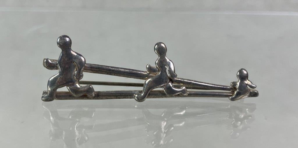 Theo Sable Sterling Silver Runner Design Brooch: Sterling silver brooch by Theo Sable of Theo Designs, New York artist (1934–2025), featuring a dynamic motif of runners in motion upon a track. Stamped “Theo” and
