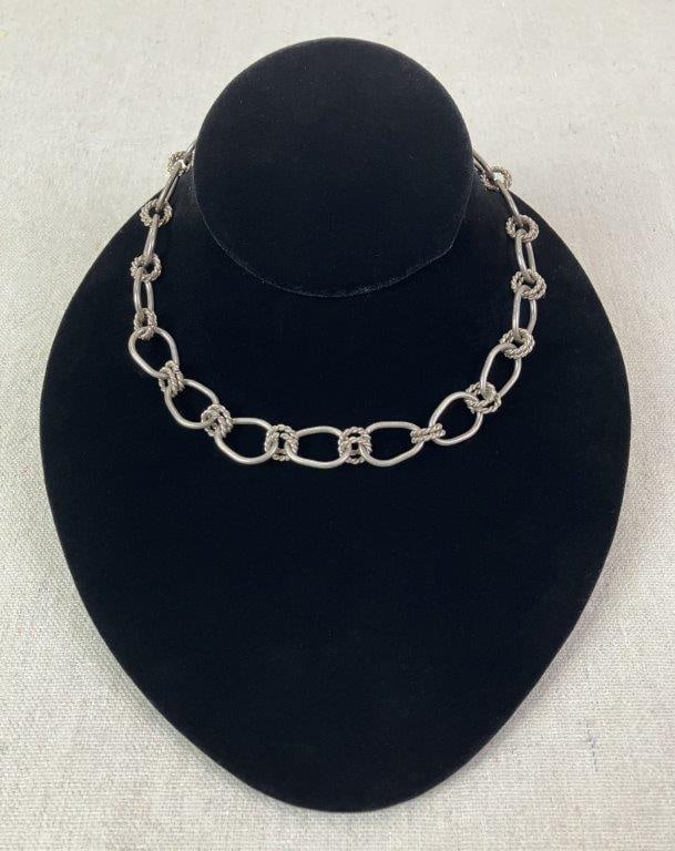Sterling Silver Circle and Rope Necklace: Artisan-crafted sterling silver necklace composed of interlocking circular loops combining smooth bands and rope-textured elements in a bold, dimensional design. Measures approx. 14" L. Total weight