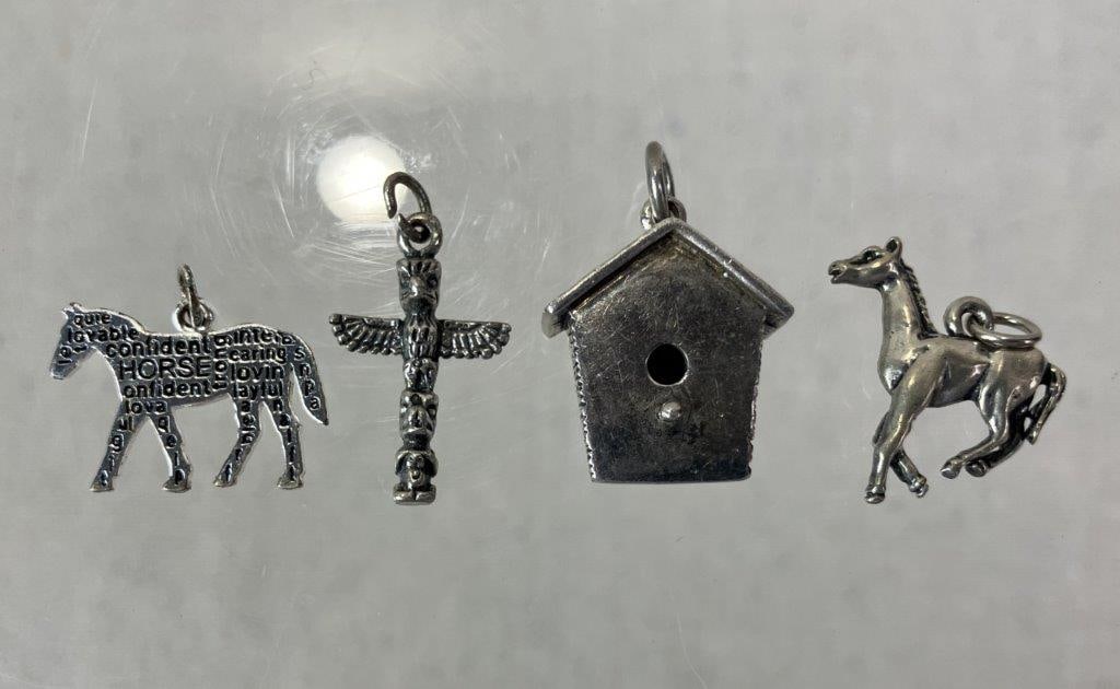 Sterling Silver Charm Group: Grouping of sterling silver charms including two horse charms (one marked and one tested), one Native American totem motif, and one birdhouse charm by Brown County Silver Co., marked for sterling