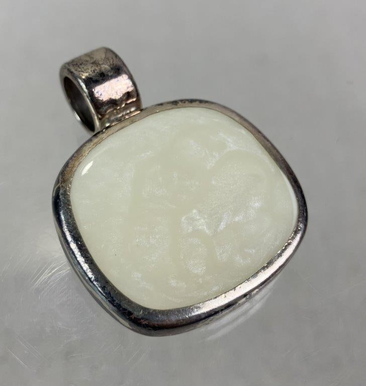 Mexican Sterling Silver Inlay Pendant: Artisan Mexican sterling silver pendant marked for silver content and ATI (Athra Trading Inc.), featuring a possible pearlescent moonstone or faux enamel inlay framed within a simple sterling setting