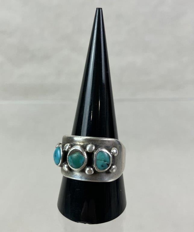 Native American Sterling Silver and Turquoise Ring: Native American ring featuring three turquoise cabochons set within a beaded sterling silver border and mounted to a robust sterling band. Ring size approx. 10. Unmarked but tested for silver content.