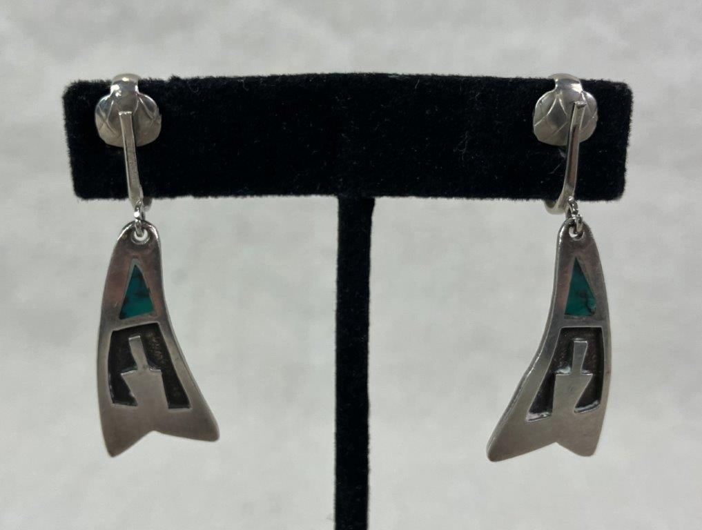 Native American Sterling Silver and Turquoise Inlay Earrings: Elegant Native American clip-on dangle earrings featuring a distinctive Navajo-inspired motif accented with triangular turquoise inlay. Unmarked but tested for sterling silver content. One earring