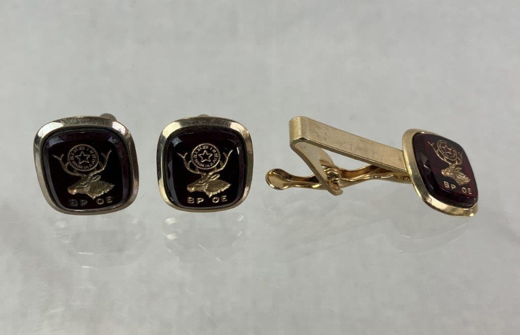Vintage Benevolent and Protective Order of Elks Tie Clip and Cuff Links: Vintage goldtone tie clip and cuff links featuring the symbolic emblem of the Benevolent and Protective Order of Elks. Tie clip measures approx. 1 5/8" H x 3/4" W. In good overall vintage condition