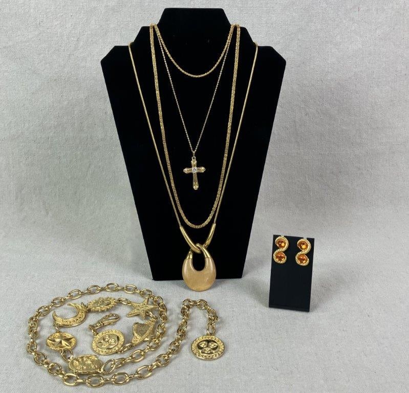 Goldtone Jewelry Assortment Including Trifari and Napier: Assorted goldtone costume jewelry grouping including vintage Trifari and Napier examples. Highlights include a standout Trifari necklace featuring a peach lucite open teardrop form suspended from a ro