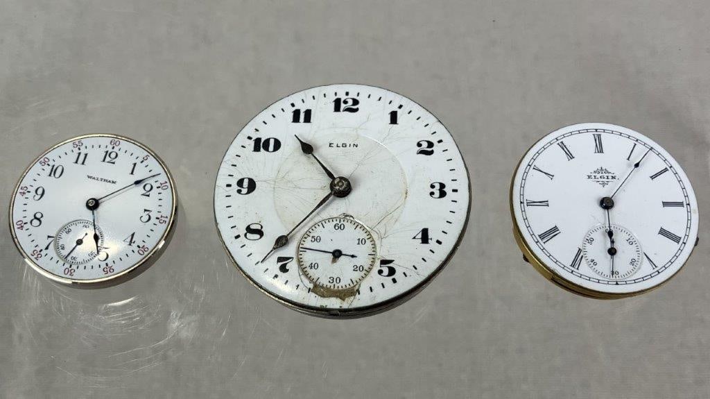 Three Vintage Pocket Watch Movements: Group of three vintage pocket watch movements including an Elgin example with seconds dial, reverse marked “Elgin Natl Watch Co. U.S.A. 17 Jewels 24029390”; a smaller Elgin movement with