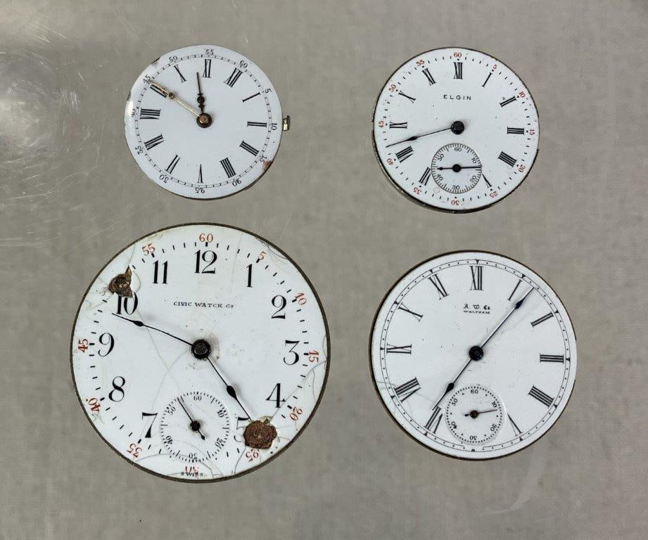 Four Vintage Pocket Watch Movements: Group of four vintage pocket watch movements including a Civic Watch Co example with open face dial and blue steel hands, reverse marked “15 Jewels Swiss Civic Watch Co”; an American