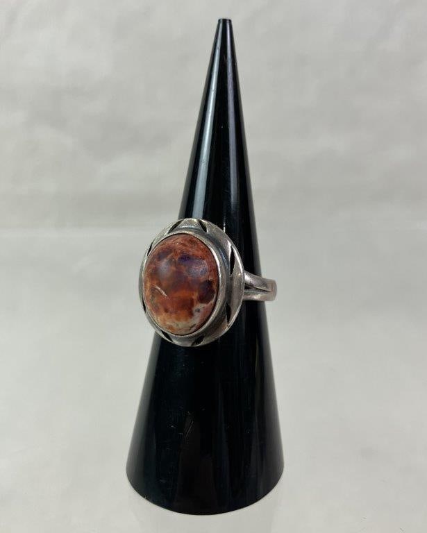 Sterling Silver Artisan Ring: Sterling silver artisan-crafted ring featuring a central cabochon in speckled brick red and marbled white tones, set within a handcrafted frame and coordinating band. Ring size approx. 6. Total weight