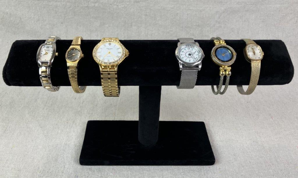 Assortment of Women's Wristwatches Including Bulova: Collection of women's wristwatches including examples by Bulova, Pierre Nicol, Oleg Cassini, Citizen, Prestige Medical, and Timex. One standout Bulova features a gold tone and silver tone band,