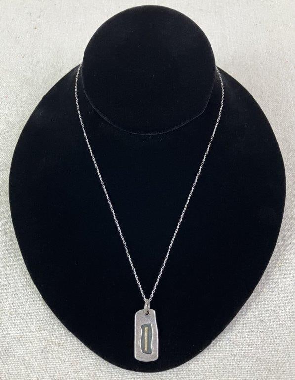 Mexican Modernist Sterling Silver Necklace: Mexican modernist sterling silver necklace featuring a clean geometric pendant composed of a rectangular frame with an interior linear accent, suspended from a delicate chain. Reverse marked