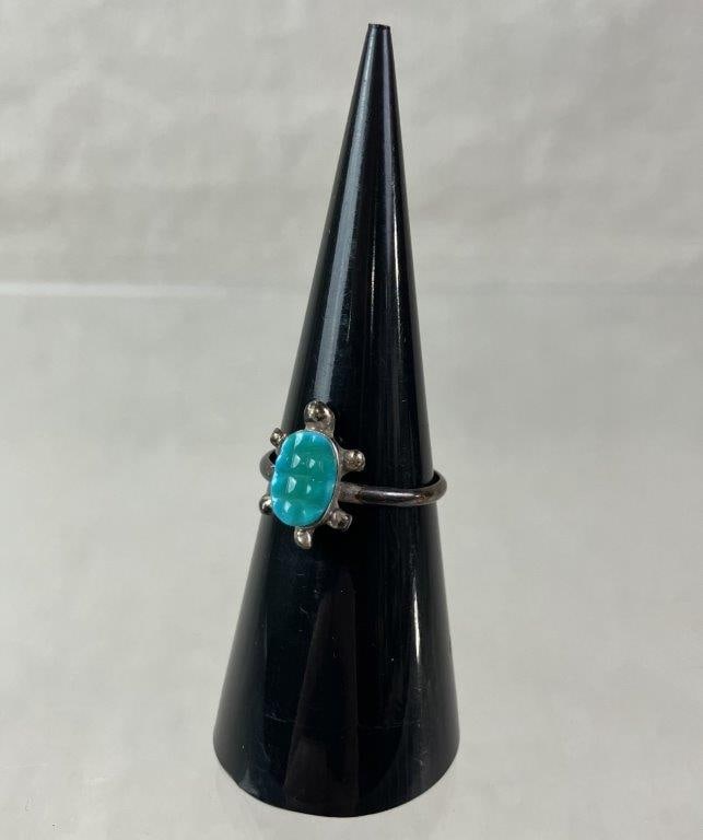 Handmade Sterling Silver Turtle Ring: Handmade sterling silver ring designed in the form of a turtle, set with a textured turquoise gemstone to the shell. Ring size approx. 6. Total weight approx. 1.39g. In good condition with light wear