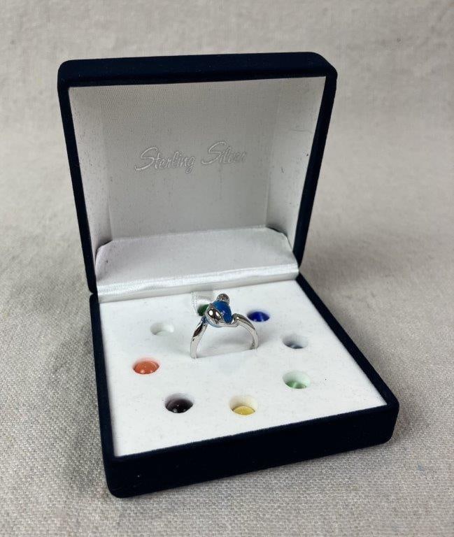 Sterling Silver Dolphin Magic Sphere Ring: Sterling silver ring featuring two dolphins mounted to a simple band, designed to hold nine interchangeable colored spheres crafted of cat's eye glass. Stamped 925 SE. Ring size approx. 8.25. Total