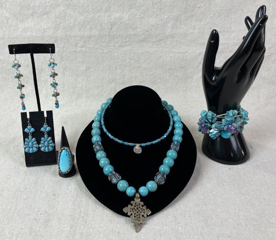 Costume Beaded Necklaces with Turquoise-Tone Accents: Grouping of costume beaded necklaces featuring turquoise-tone beads in a Southwestern-inspired theme, including faceted examples and shell-style bead varieties. One necklace measures approx. 18" L