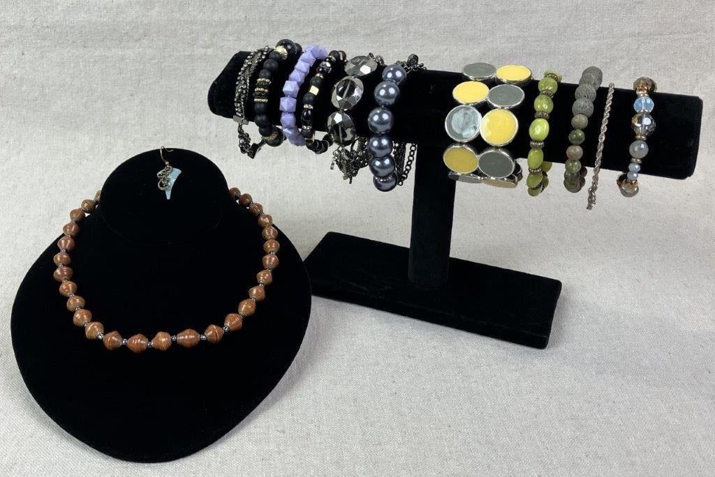 Beaded Costume Jewelry Assortment: Collection of beaded costume jewelry comprising one necklace and eleven bracelets, all statement pieces featuring multicolored beads, faux stones, faux pearls, and acrylic elements. Necklace measures