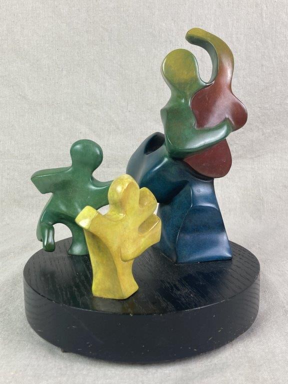 Bronze Dancer Scultpure by Theo Sable: A vibrant and complex abstract bronze sculpture depicting figures dancing, with the largest figure playing a guitar. The composition is dynamic and playful, finished in colorful painted segments of