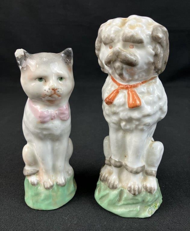 Staffordshire Dog and Cat Figurines: a charming pair of mantle-style ceramic figures featuring the iconic hand-painted details and endearing folk-art character synonymous with English Staffordshire pottery, consisting of a noble canine
