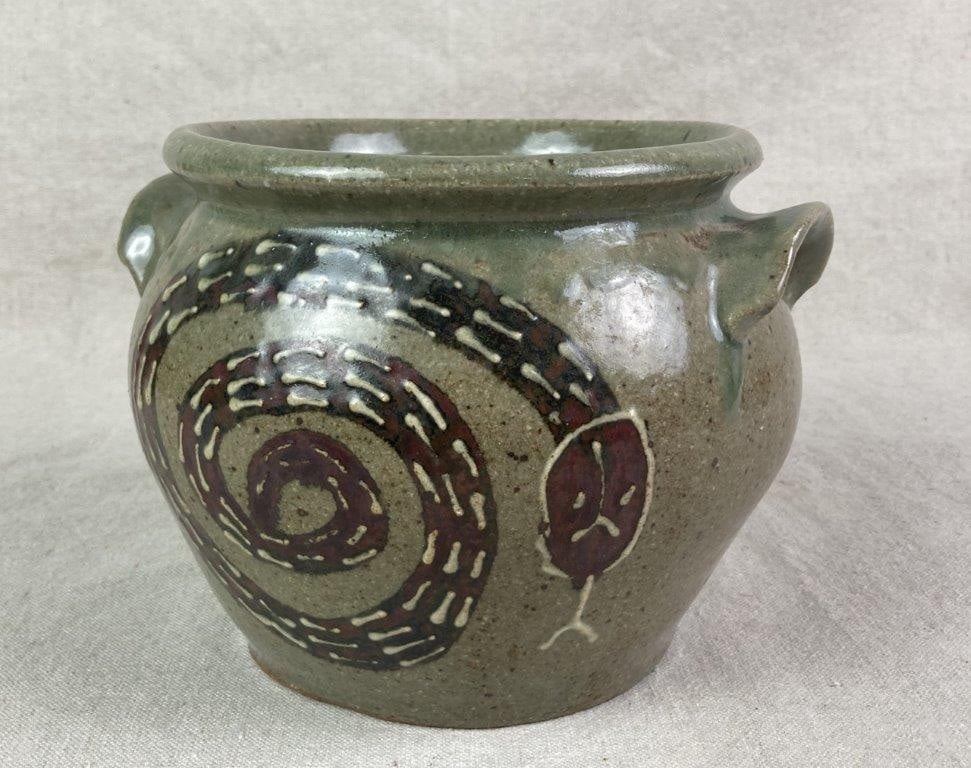 Jim Bozeman Stoneware Snake Pot: A hand-thrown Georgia folk pottery jar with alkaline glaze, featuring a coiled snake design with red coloration and applied lug handles. Signed “Bozeman Maker 6-19 GA” on the underside.