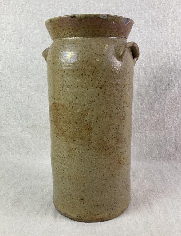 Columbia South Carolina Stoneware Churn: Stoneware jar with a tall cylindrical body, flared rim, and two applied lug handles. Finished in a beautiful Columbia light tan glaze with speckling. The exterior is marked with a central incised