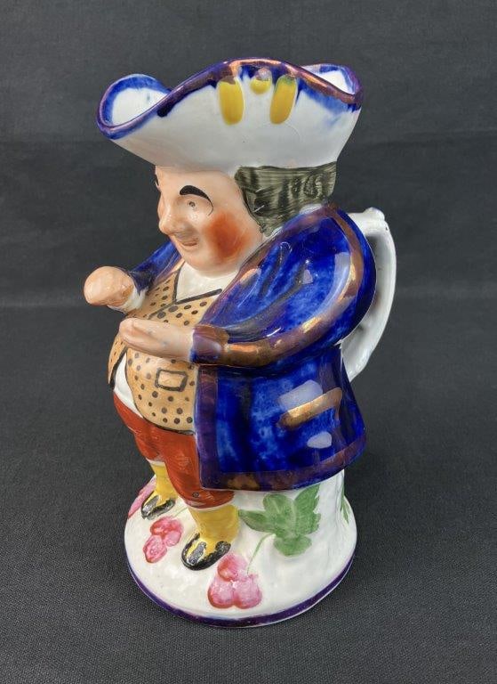 Victorian Snuff-Taker Toby Jug: 19th century Staffordshire example produced by Allerton's of England, featuring a characterful figure in a classic rounded Toby jug form. Measures approximately 9" H x 4 1/2" W x 5" D. Good condition