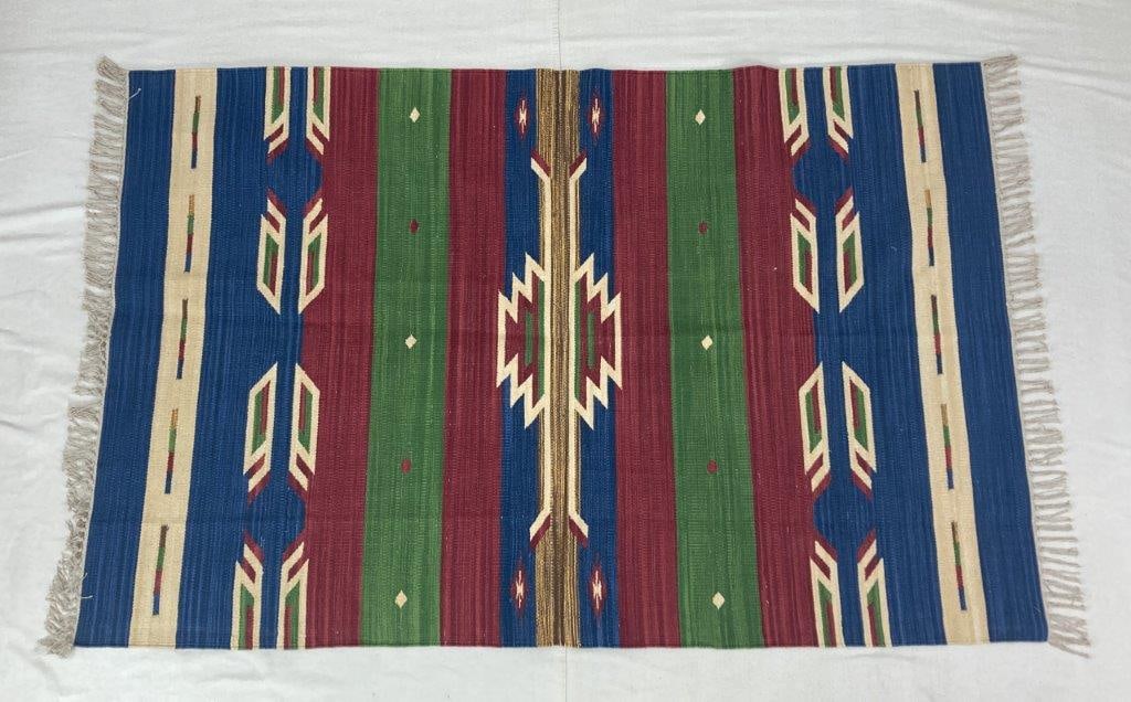 Southwestern Style Kilim Rug: Handwoven Southwestern style Kilim rug featuring a vibrant palette of reds, greens, and blues arranged in prominent geometric patterning. The flatwoven construction displays traditional textile