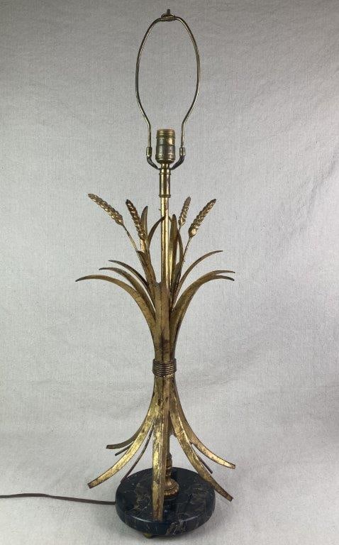 Sheaf of Wheat Gilt Table Lamp: An elegantly formed table lamp modeled as a sheaf of wheat, crafted in gilt tole and raised on a circular base of polished black marble with white veining. The surface retains a worn patina