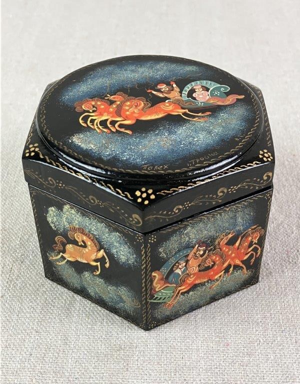 Hand Painted Russian Lacquer Box: Depicting a man driving a carriage amid the clouds with an elegant lady passenger, inspired by Russian fairy tales. Black lacquer exterior with a vibrant red interior, featuring a delicately painted