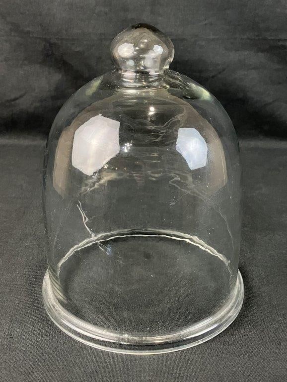 Glass Cloche Dome: Classic bell form in clear luminous glass. Measures approximately 10" H x 7 1/4" diameter. Good condition. 