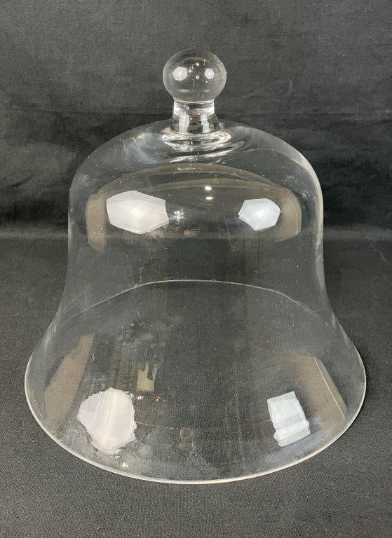 Cloche Bell Dome: Elegant curving form in clear luminous glass. Measures approximately 12" H x 12 1/4" diameter. One chip to the base. 