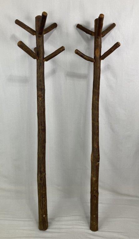 Folk Art Hickory Coat Stands: Pair of folk-art coat stands constructed from natural hickory branches, displaying rustic hand-built craftsmanship and organic forms. The stands feature natural limbs and branching elements suitable