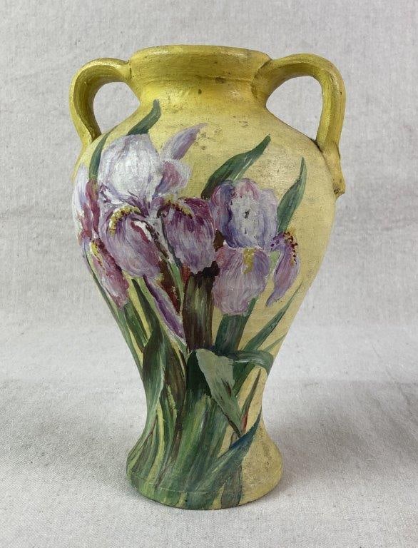 Folk Art Painted Pottery Vase: Hand-painted ceramic vase of tapered form featuring purple irises with green foliage against a vibrant yellow ground. The vessel is detailed with two applied handles and is signed "Kate S. Allen" to