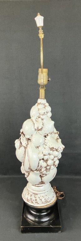 Italian Fruit Topiary Pottery Lamp: Elegant ceramic lamp featuring a sculptural topiary form composed of clustered fruit. White glazed ceramic body. Measures approximately 31" H x 6" W x 6" D. Tested for functionality. Good condition.