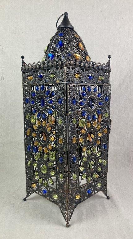 Jeweled Moroccan Brass Table Lamp: Brass table lamp with a sturdy metal frame featuring an intricate, ornate Moroccan pattern, accented with green, yellow, and blue jeweled details. Measures approximately 24" H x 8" W x 7 3/4" D. Good