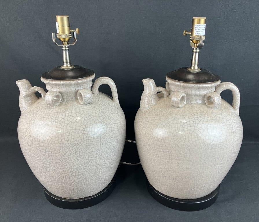 Pair of Modern Ceramic Raku Glaze Lamps: Modern ceramic lamps formed as two-handled pitchers with spout and applied handles. Finished in a distinctive raku-style craquelure glaze. One measures approximately 29" H x 10" diameter. Good