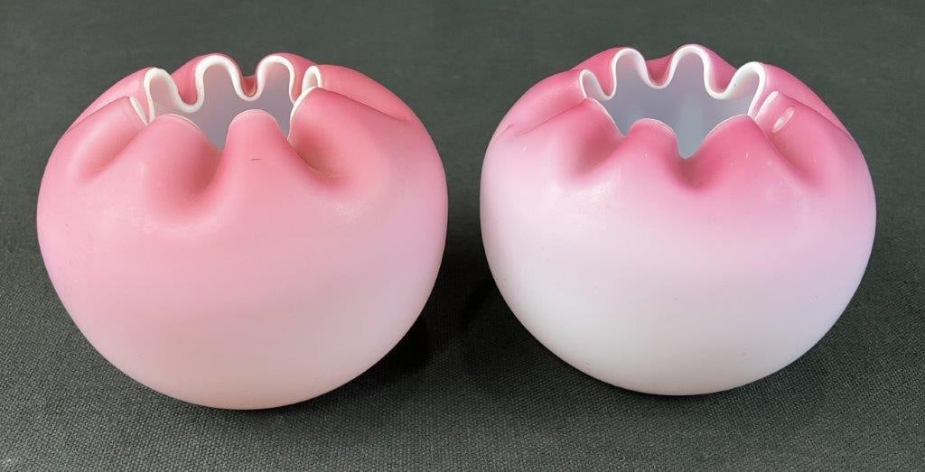 Two Victorian Satin Glass Rose Bowls: Victorian era rose bowl in rose or pink tones with a satin finish with a crimped rim and rounded form. One measures approximately 3 3/4" H x 3 1/2" diameter. Good condition with minor surface wear. 
