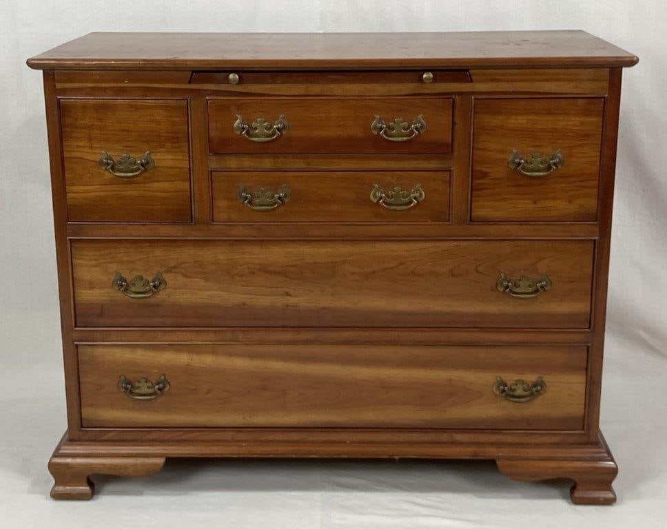 Stickley Cherry Chippendale Style Chest: High-quality Chippendale style chest by Stickley crafted in cherry, notable for its wonderful diminutive proportions. The case is fitted with six drawers and a pull-out mixing slide, arranged in an