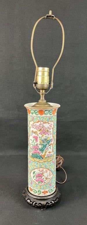 Chinese Rose Medallion Porcelain Lamp: Elegant Chinese vase converted into a table lamp with a traditional wood base. Cylindrical form decorated with alternating panels of birds and floral patterning, featuring detailed enamel work.