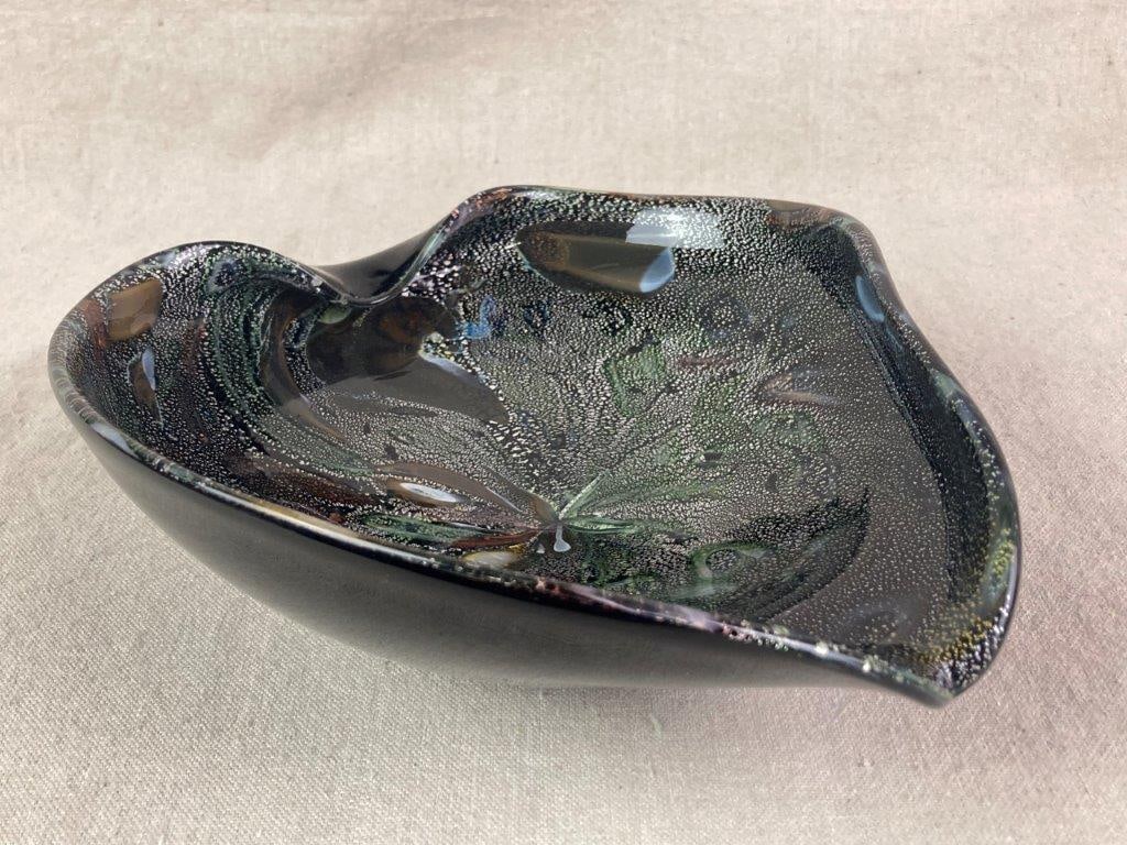 Murano Style Art Glass Bowl: A hand-blown art glass bowl of heavy, organic free-form shape with a thick undulating rim, decorated in the pulegoso technique creating thousands of silvery bubbles throughout. The body features
