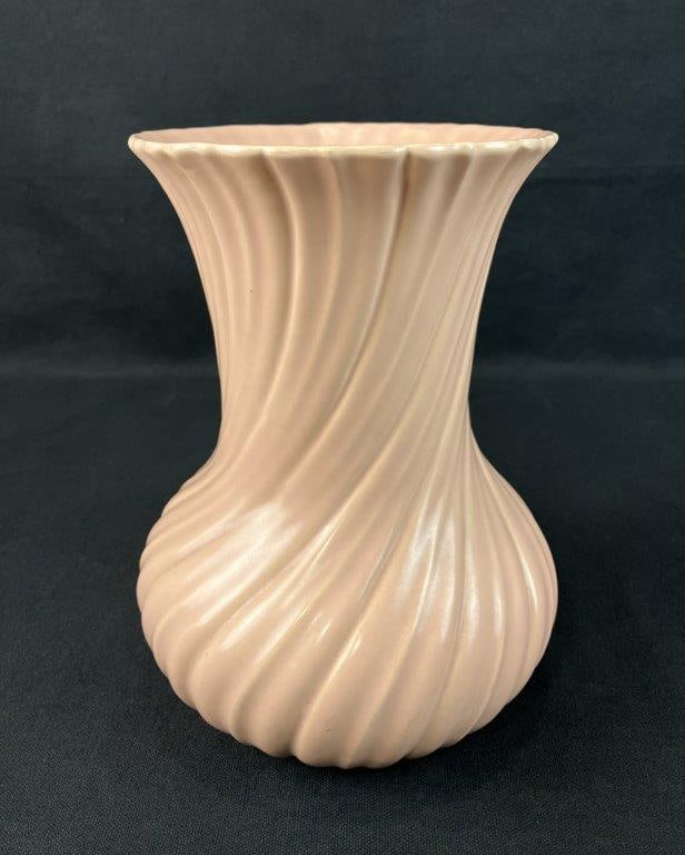 American Art Pottery Swirl Vase: Vase in a soft salmon, peach, or coral tone with dimensional swirl decoration throughout. Produced by Franciscan Pottery (later known as Franciscan Ware), a brand of Gladding, McBean & Company, and