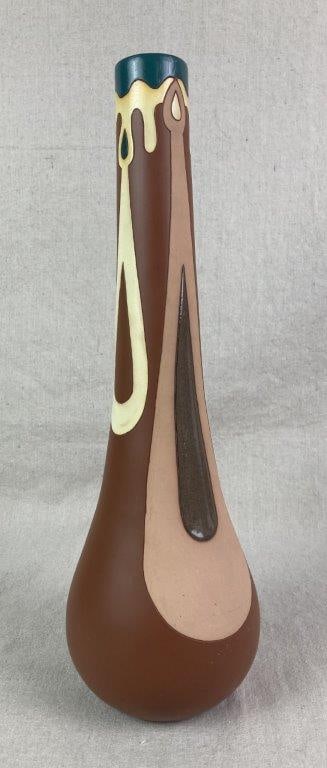 Studio Pottery Bud Vase: A hand-crafted pottery vase of classic bud form with a slender neck, decorated in a layered clay slip technique with flowing lines and a distinctive melting wax motif, combining warm earth tones with