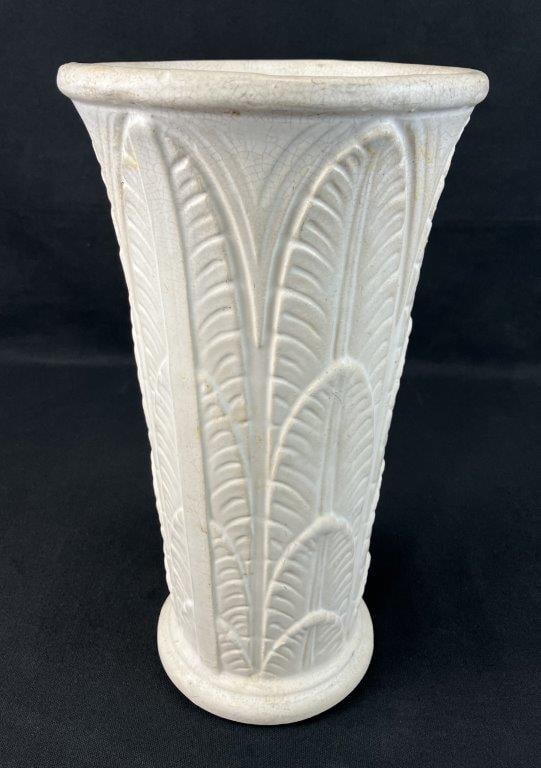 Robinson Ransbottom Pottery Company Art Deco Vase: Circa 1930 example featuring palm leaf patterning on a fluted columnar form with a slightly flared lip. Finished in an elegant crackle glaze. Measures approximately 12 5/8" H x 7" diameter. Natural